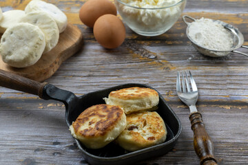 Syrniki or syrniki with cottage cheese and currant berries. Healthy breakfast concept. Delicious dessert or sweet breakfast.