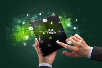 Businessman holding a foldable smartphone, social media concept