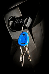 modern vehicle key in ignition slot of semi truck tractor