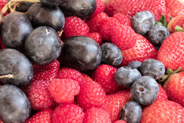 Assorted Ripe Juicy Summer Berries, Grapes, Blueberries, Strawberries. Background Picture