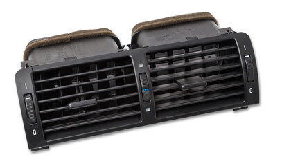 A close-up view of a part of the interior of a modern car with a view of the ventilation deflector of the heater for heating and cooling the passenger compartment. Used auto part catalog from junkyard