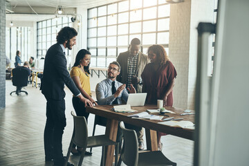 We can only go up from here. Shot of a diverse team of businesspeople brainstorming their latest project together in the office.