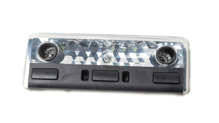 Fototapeta premium spare part from the car on a white isolated background is a cover for the illumination of a standart sign on the interior for replacement and repair. Spare parts catalog.