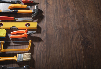 Work tools on the wooden background.