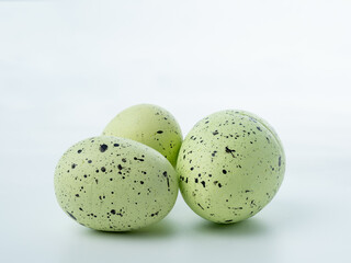 Close-up, colored styrofoam eggs on a white background.