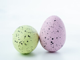 Close-up, colored styrofoam eggs on a white background.