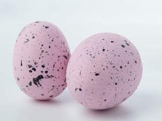 Close-up, colored styrofoam eggs on a white background.