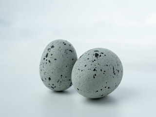 Close-up, colored styrofoam eggs on a white background.