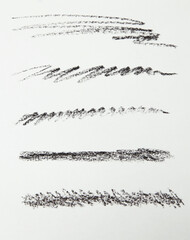 Cosmetic pencil samples isolated on a white background Hand drawn hatching shapes on isolated white background. Wavy tangled doodles. Black and white illustration