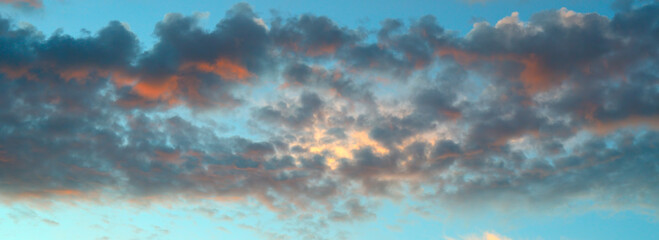 Fototapeta na wymiar Colorful dramatic sky with cloud at sunrise. Wide photo.