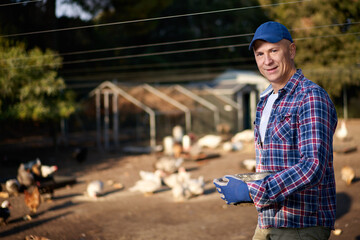 portrait of man on chicken farm