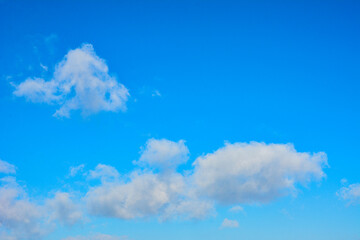 Naklejka na ściany i meble Blue beautiful sky with white clouds in sunny day