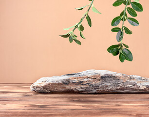 Driftwood and fresh green leaves on a brown wooden background, front view, copy space.  Empty showcase for product presentation of herbal medicine, organic or eco cosmetic product.