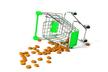 Overturned grocery cart with cat food on a white background.