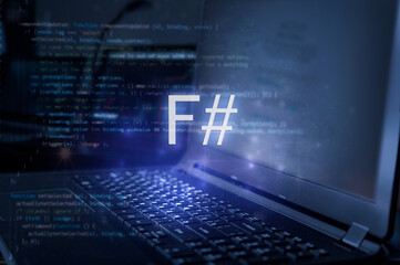 F# (F sharp) inscription against laptop and code background. Technology concept. Learn programming language.