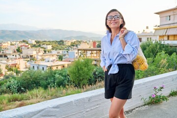 Eco tourism, woman walking relaxing in European mountain village