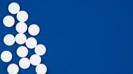 Medcine white pills aspirin pharmacy on blue background