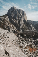 Fototapeta na wymiar Termessos ancient city ruins in Turkey, amphitheatre in mountains, historical landmarks abandoned buildings