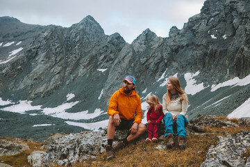 Fototapeta premium Family traveling relaxing in mountains summer vacations mother and father hiking with child camping outdoor adventure active healthy lifestyle eco tourism
