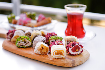 Traditional tea with locum sweets Turkish delight.
