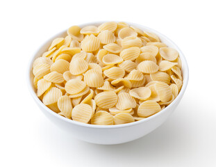 Uncooked orecchiette pasta in white bowl isolated on white background with clipping path