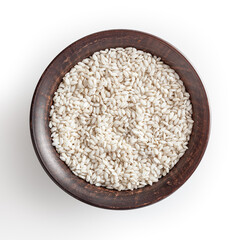 Uncooked arborio rice in ceramic bowl isolated on white background with clipping path
