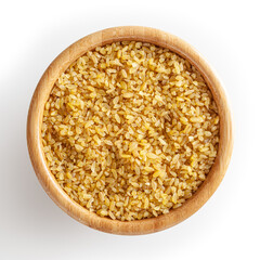 Dried bulgur in wooden bowl isolated on white background with clipping path