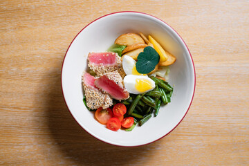 Salad with tuna, egg and asparagus. Menu design concept for a restaurant.