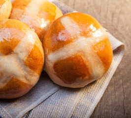 Hot cross buns on basket Top view, copy space. Easter baking
