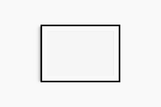 Horizontal frame mockup 7:5, 70x50, A4, A3, A2, A1 landscape. Single black frame mockup. Clean, modern, minimalist, bright. Passepartout/mat opening in 3:2 aspect ratio.
