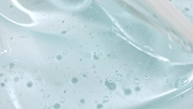 Transparent Blue Cosmetic Gel Fluid. Beauty skincare product sample. Macro Shot Serum, Cream, hyalurinic acid. Organic cosmetics, medicine. Concept Skin care. High quality 4k footage