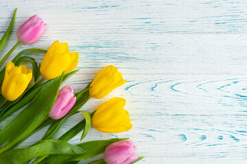 Tulips on a wooden background. Spring background.