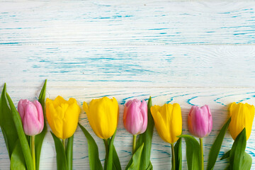 Tulips on a wooden background.