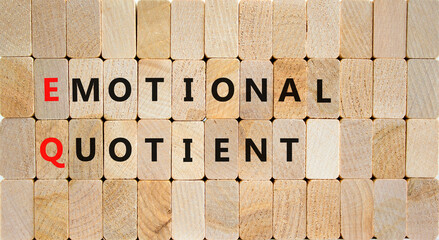 EQ emotional quotient symbol. Concept words EQ emotional quotient on wooden blocks on a beautiful wooden background. Business EQ emotional quotient concept, copy space.