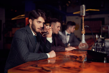 respectable man sitting in bar
