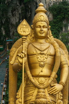 Close up of face of the Murugan Statue (Tugu Dewa Murugga) in Batu Caves, Selangor, Kuala Lumpur. Tallest statue of a Hindu deity in Malaysia made with 300 liters of Gold Paint and 350 tons steel bar.
