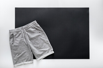 Gray shorts pants for man sport. Basic casual clothing sports gray male shorts On white black frame...