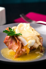 Poacheg egg with bacon on bread