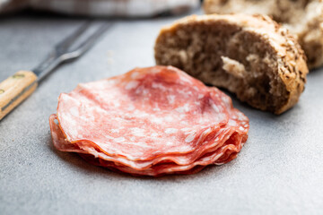 Sliced salami. Chopped pork sausage