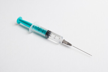 Medical syringe on a white background