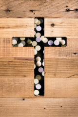 Christian cross wooden background and blurred bokeh lights. Christian faith wood background