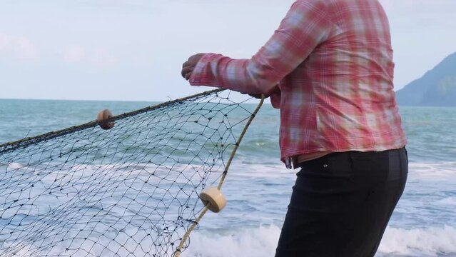 Artisanal collective fishing in Playa Hermosa in Mexico. Traditional or subsistence fishing consists of various small-scale, low-technology, low-capital, fishing practices undertaken by individuals