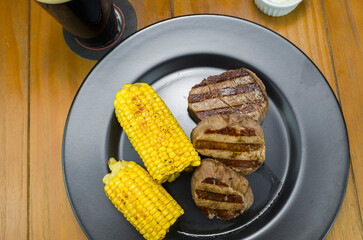 Delicious filet mignon close-up with roasted corn