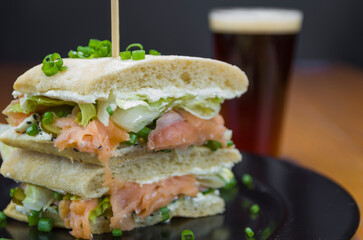 Delicious salmon sandwich close-up.