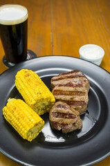 Delicious filet mignon close-up with roasted corn
