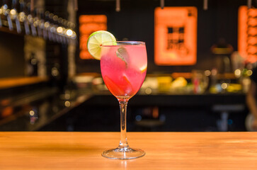Close-up of delicious drink in glass of red berries.