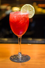 Close-up of delicious drink in glass of red berries.