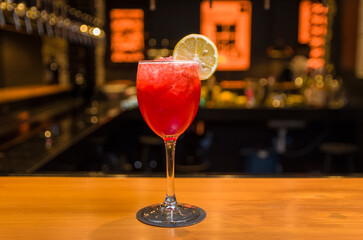 Close-up of delicious drink in glass of red berries.