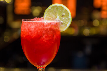 Close-up of delicious drink in glass of red berries.