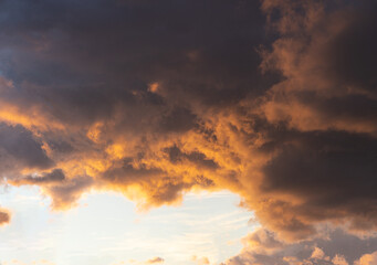 The glow of a beautiful bright sky through the dark red ominous clouds